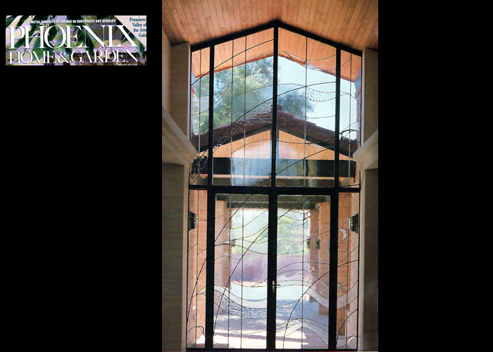 Another double mirror image steel framed entryway (only one side of double entry shown) in textured clear and beveled glass.  
      This home was featured in Phoenix Home Garden.